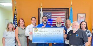 Senator Manny Diaz Jr. Presents VG a Check for $290,000