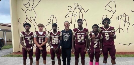 Jimmy Pino with the MSSH Golden Hawks Football Team