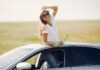 How Much Does it Cost to Get Car Service in Miami? Woman through Car Sunroof