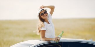 How Much Does it Cost to Get Car Service in Miami? Woman through Car Sunroof