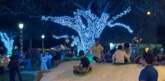 The Christmas Spirit is Alive in Miami Springs Kids sledding on the Circle
