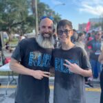 Gabriel Fernandez and his son at the River Cities Festival 5k 2023
