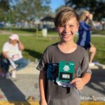 Sebastian Suarez happy to win a Gift Card Raffle at the River Cities Festival 5k 2023