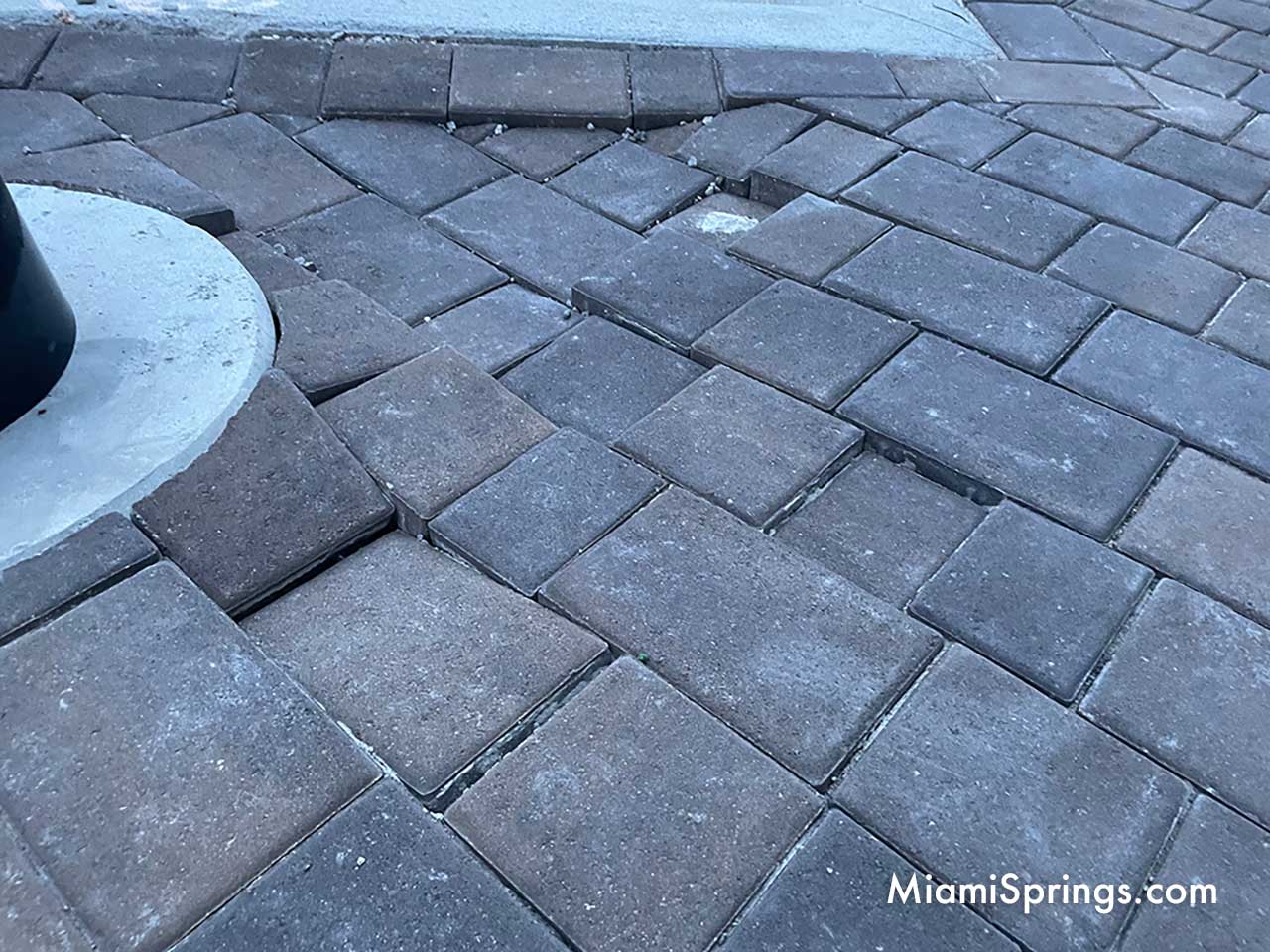 Trip Hazard: Pavers collapsing along Canal Street sidewalk in front of the Miami Springs Town Center located at One Curtiss Parkway in Miami Springs (Photo Credit: MiamiSprings.com)