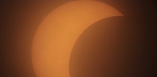 Solar Eclipse Caught in Springs despite Cloud Cover Solar Eclipse over Miami Springs