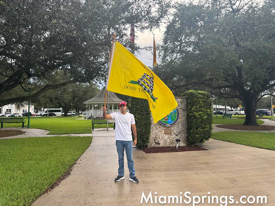 Activist waving flag in support of Charlie Kirk