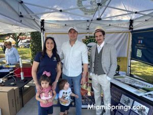 Miami-Dade Countyy Commissioner, Natalie Orbis, with her family at the Glenn Curtiss Vintage Motorcycle and Classic Car Show in Miami Springs Nov 1, 2025