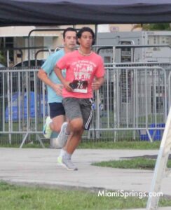 Lester Rangel (40 Blue Shirt) and Alejandro Quirantes (14 Peach Shirt) at the River Cities Regatta 5K Run