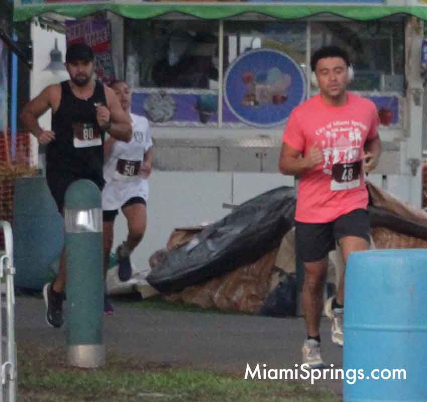 Jean Rivas (35 left), Jayda Jagessar (14 center), and Roger Hulse (19 right) at the River Cities Regatta 5K Run