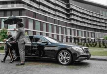 Miami’s Busiest Travel Year Is Changing How Locals Get Around professional chauffeur welcoming a passenger in Miami
