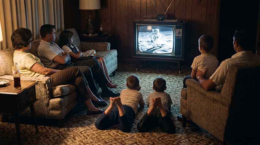 Family watching the moon landing