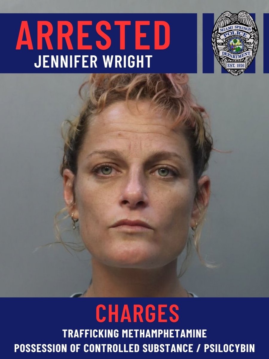 Booking graphic of Jennifer Wright with charges listed as trafficking methamphetamine and possession of controlled substance/psilocybin