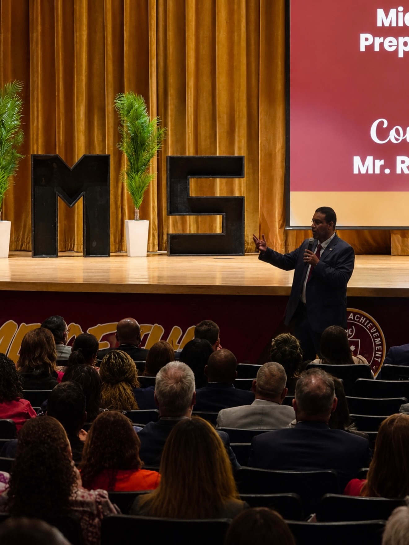 Superintendent Rafael Villalobos speaking on stage