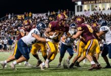 Golden Hawks Soar Past Conchs in Thrilling 14-10 District Battle